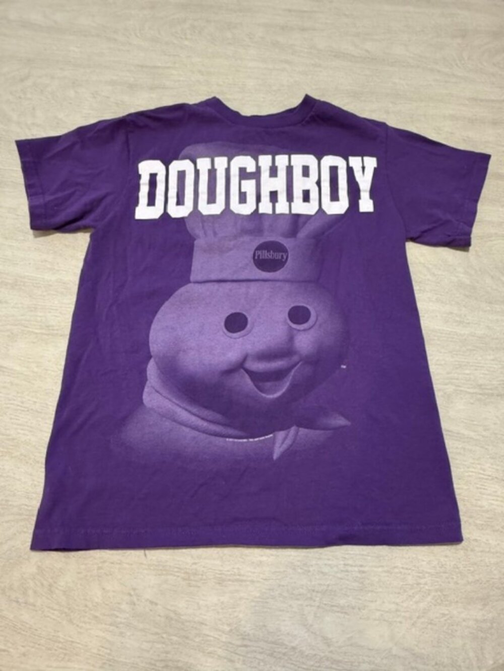 Delta Pro-Weight Pillsbury Doughboy purple t-shirt.